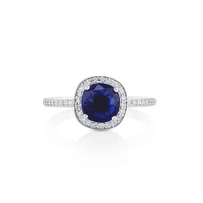 ladies engagement rings-Blue Sapphire and Diamond Halo Ring