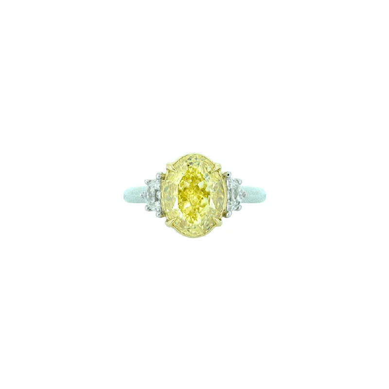 ladies chunky rings-18 Karat White and Yellow Gold Three Stone Ring with Oval Cut Fancy Yellow Diamond and white Half moon diamonds