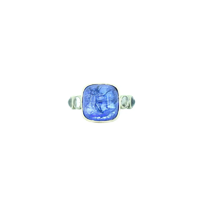 ladies statement gemstone rings-18 Karat White Gold ring with Tanzanite Cabochon and 4 Round Moonstones